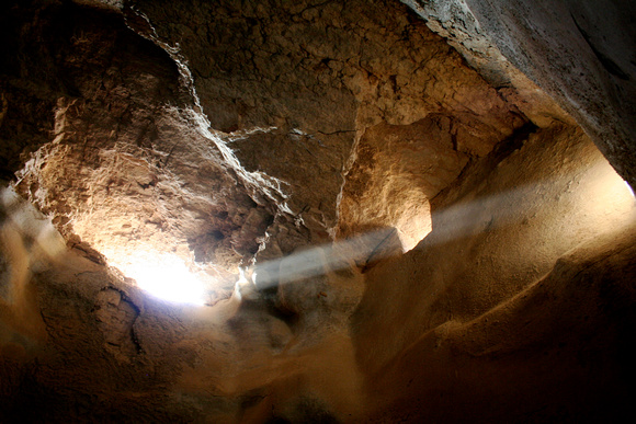 Sunlight passing through the ancient water cistern of Masada, Israel